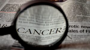 cancer, newspaper, word, magnifier, magnifying glass, loupe, reading, zoom, disease, health, illness, medicine, definition, lymphoma, melanoma, carcinoma, gray health, gray reading, gray zoom, gray glass, gray medicine, gray cancer, gray glasses, gray newspaper, cancer, cancer, cancer, cancer, cancer